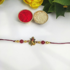 Divine Ganesha Rakhi – Red & Gold Beads